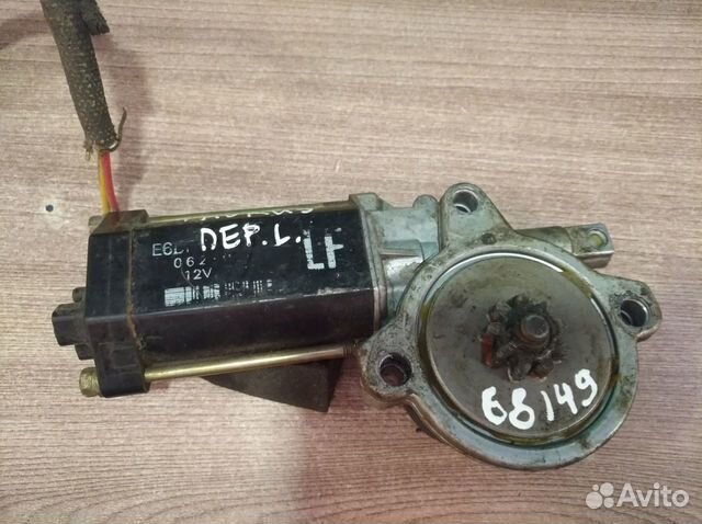 Моторчик стеклоподъемника пер. левый Форд Таурус